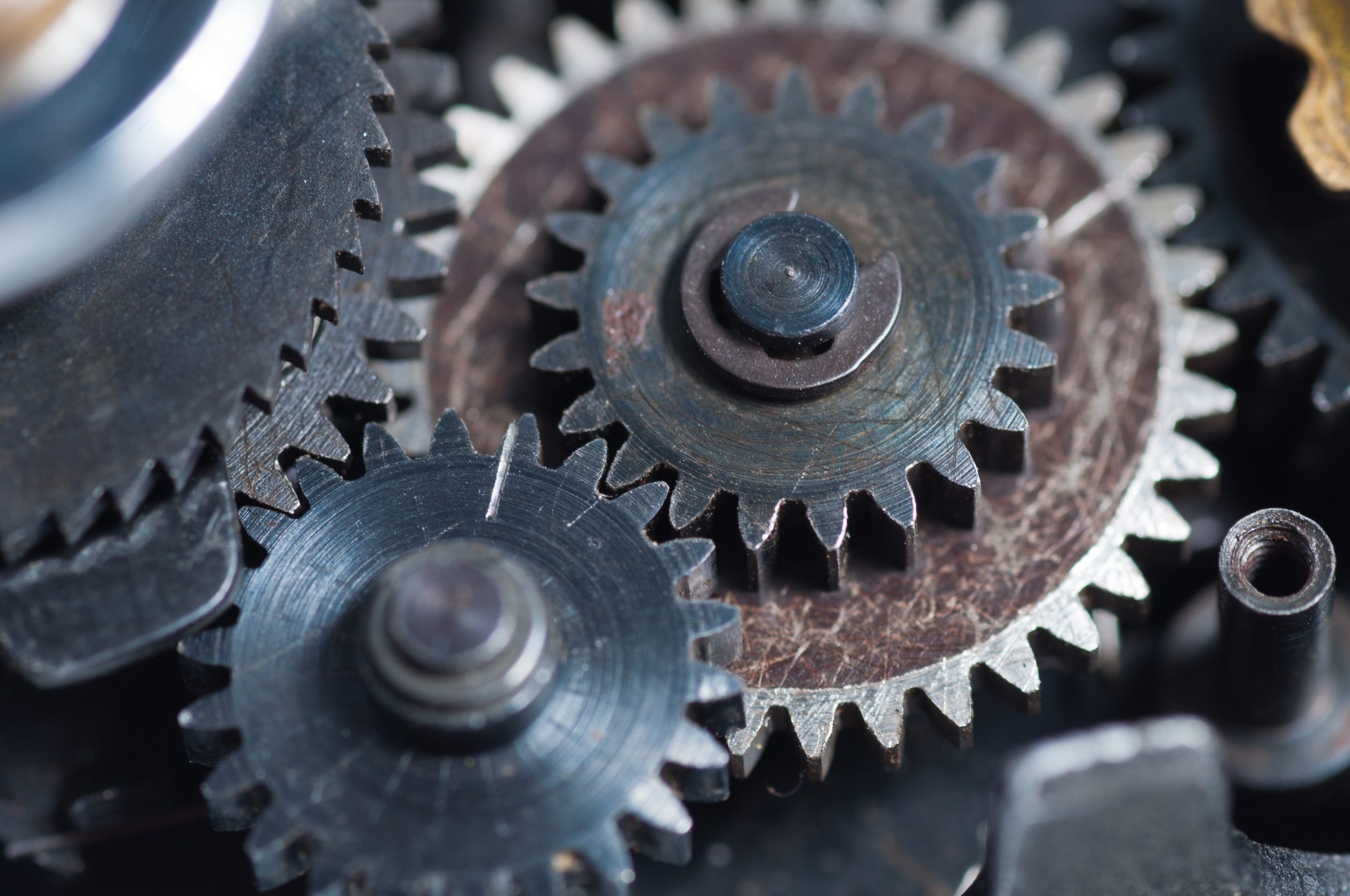 A set of 3 meshed gears from a vintage camera